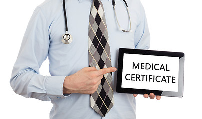 Image showing Doctor holding tablet - Medical certificate