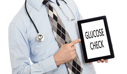 Image showing Doctor holding tablet - Glucose check