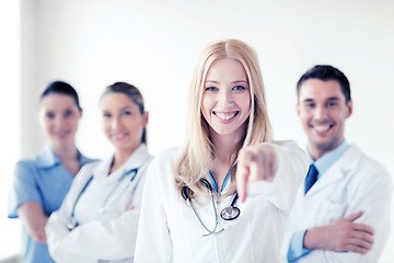 Image showing female doctor in front of medical group