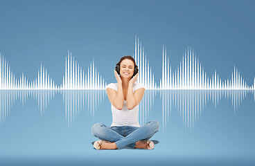 Image showing smiling young woman or teen girl in headphones