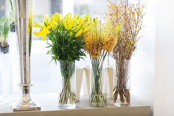 Image showing close up of flowers in vases at flower shop