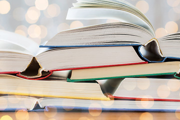 Image showing close up of books on wooden table