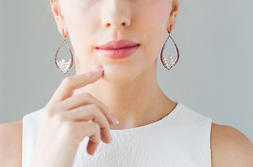 Image showing close up of beautiful woman face with earrings