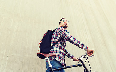 Image showing hipster man with fixed gear bike and backpack