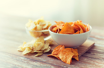 Image showing close up of potato crisps and nachos in glass bowl