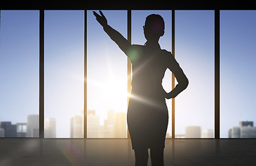 Image showing silhouette of business woman pointing hand
