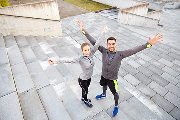 Image showing happy smiling couple outdoors on city street