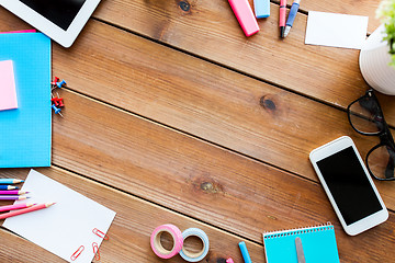 Image showing close up of stationery and smartphone on table