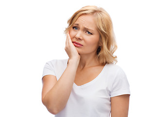 Image showing unhappy woman suffering toothache