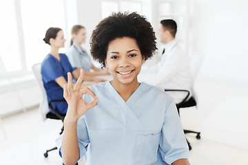 Image showing doctor or nurse showing ok hand sign at hospital