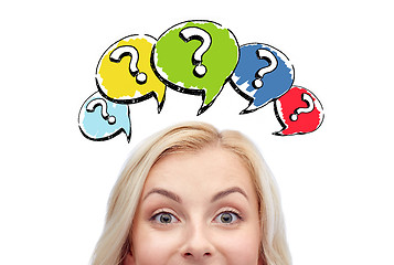 Image showing happy young woman head with question marks