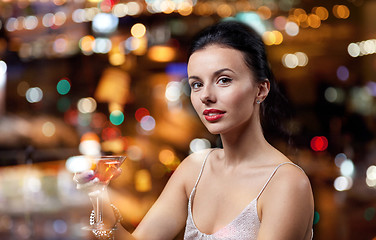 Image showing glamorous woman with cocktail at night club or bar