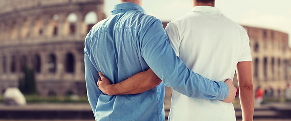 Image showing close up of male gay couple over coliseum in rome