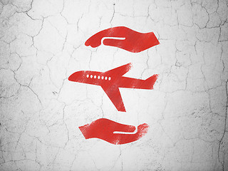 Image showing Insurance concept: Airplane And Palm on wall background