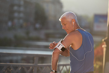 Image showing portrait of handsome senior jogging man