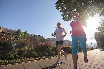 Image showing female friends jogging