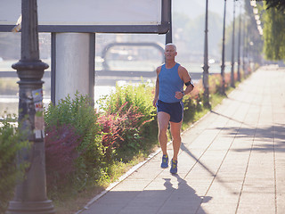 Image showing handsome senior man  jogging