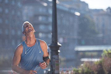 Image showing portrait of handsome senior jogging man