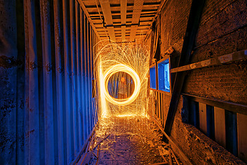 Image showing Burning Steel Wool spinning. Showers of glowing sparks from spin
