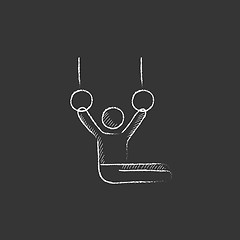 Image showing Gymnast performing on stationary rings. Drawn in chalk icon.