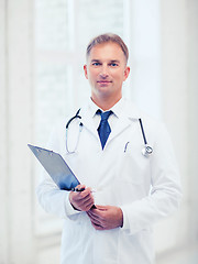 Image showing male doctor with stethoscope and clipboard