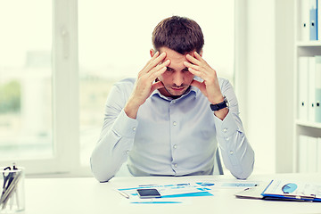 Image showing close up of businessman with smartphone