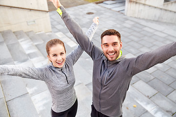 Image showing happy smiling couple outdoors on city street