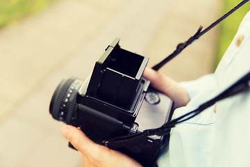 Image showing close up of male photographer with digital camera