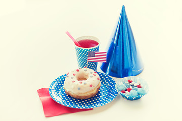 Image showing donut with juice and candies on independence day