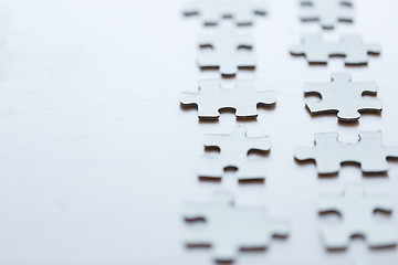 Image showing close up of puzzle pieces on table