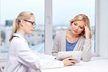 Image showing doctor with tablet pc and ill woman at hospital