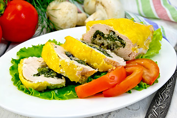 Image showing Roll chicken with mushrooms on salad in plate