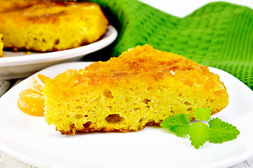 Image showing Pie mandarin with mint and green napkin on board