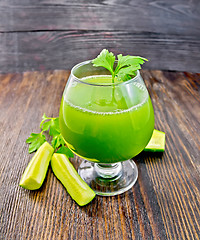 Image showing Juice cucumber with parsley in wineglass on board