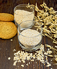 Image showing Bran and flour oat in glass with cookies on board