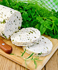 Image showing Cheese homemade with spices and napkin on board