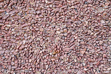 Image showing Wall of red granite gravel