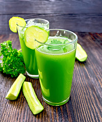 Image showing Juice cucumber in two tall glass on dark board