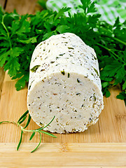 Image showing Cheese homemade with spices and herbs on board