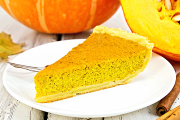 Image showing Pie pumpkin in white plate on board