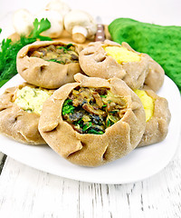 Image showing Carols with different fillings and parsley on light board