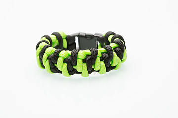 Image showing green braided bracelet on white background