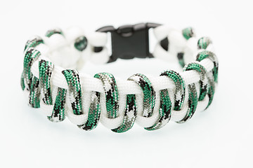 Image showing green braided bracelet on white background