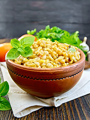 Image showing Barley porridge with basil on napkin