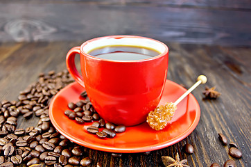 Image showing Coffee in red cup with sugar on board