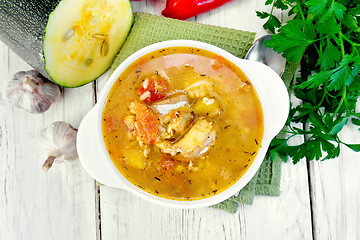 Image showing Soup fish with zucchini and peppers on board top