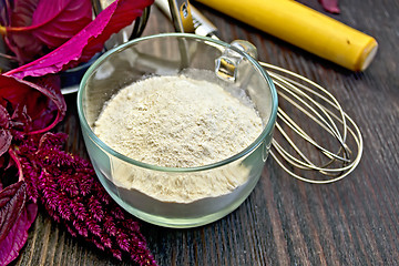 Image showing Flour amaranth in cup with rolling pin on board