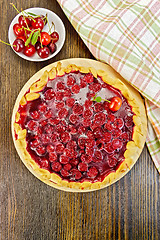 Image showing Tart cherry with berries on board top