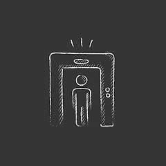 Image showing Man going through metal detector gate. Drawn in chalk icon.