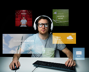 Image showing man in headset computer over virtual media screens